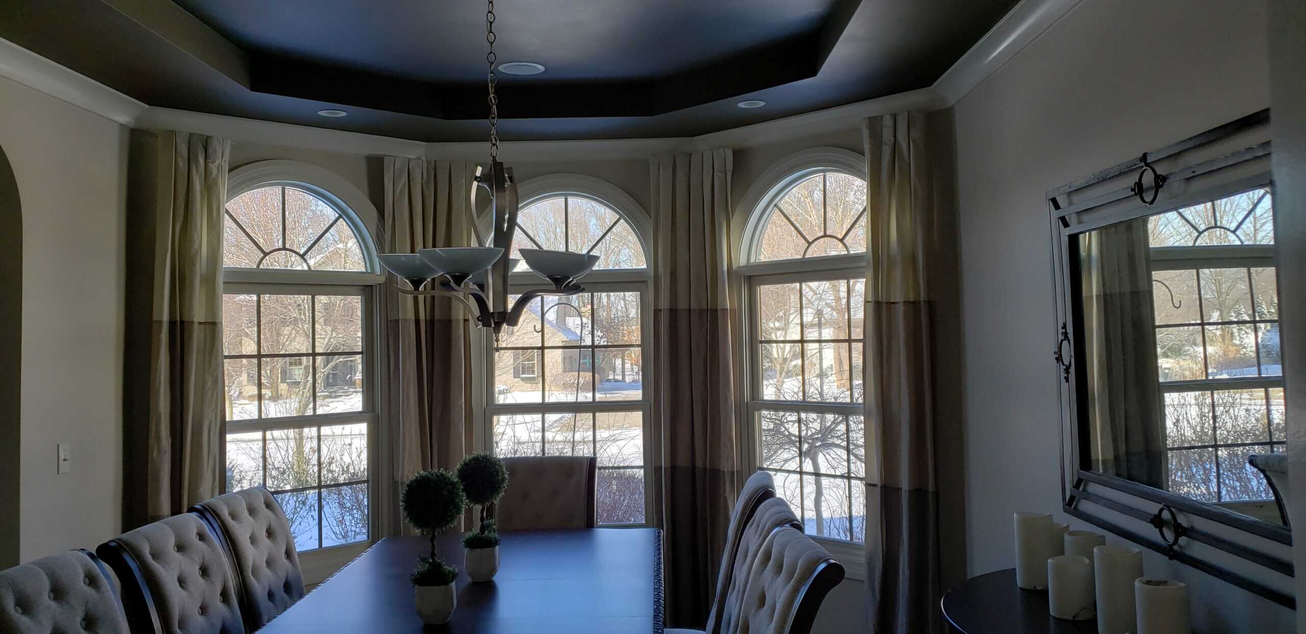 Completed dining room remodel with tray ceiling and arched windows in Columbus Ohio