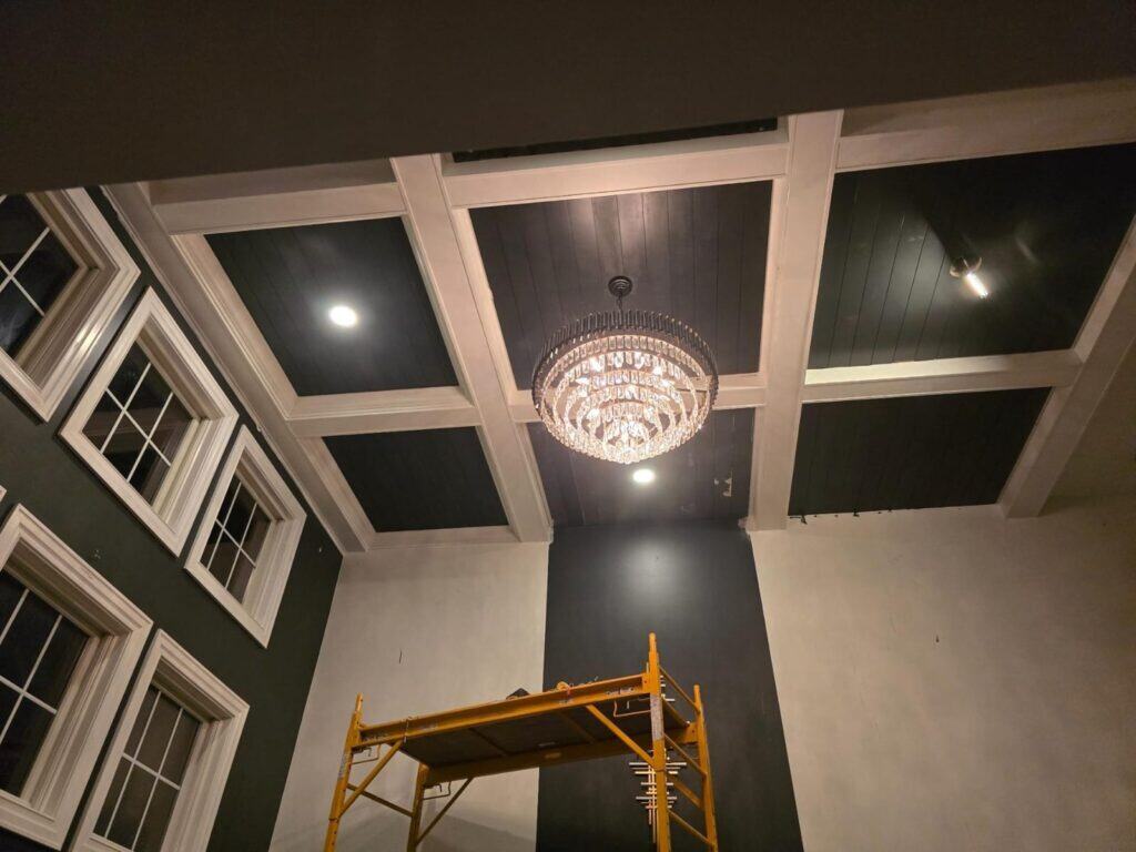 Coffered ceiling installation in Lewis Center, OH featuring poplar beams, crown molding, and premium painted finish by PaintWerks.