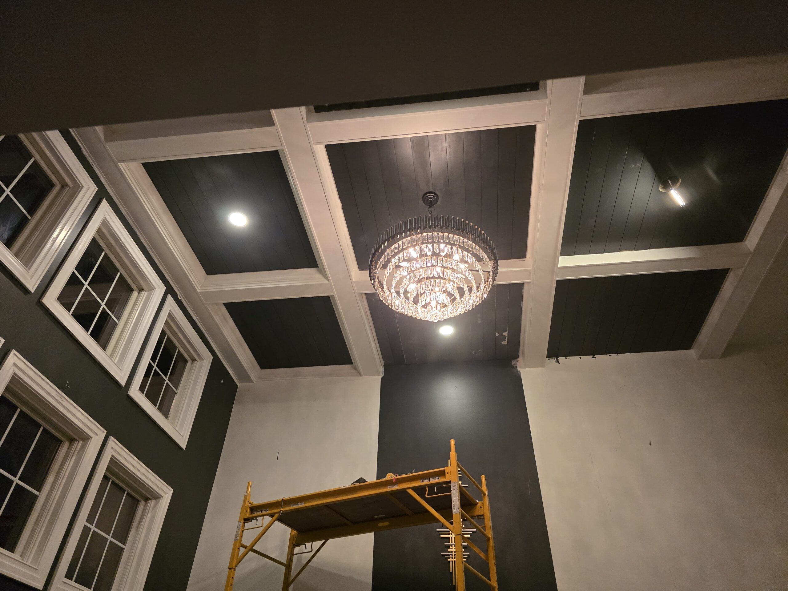 Custom coffered ceiling built by PaintWerks in Lewis Center, Ohio with poplar beams, new can lighting, and detailed crown molding. residential painting contractor lewis center ohio