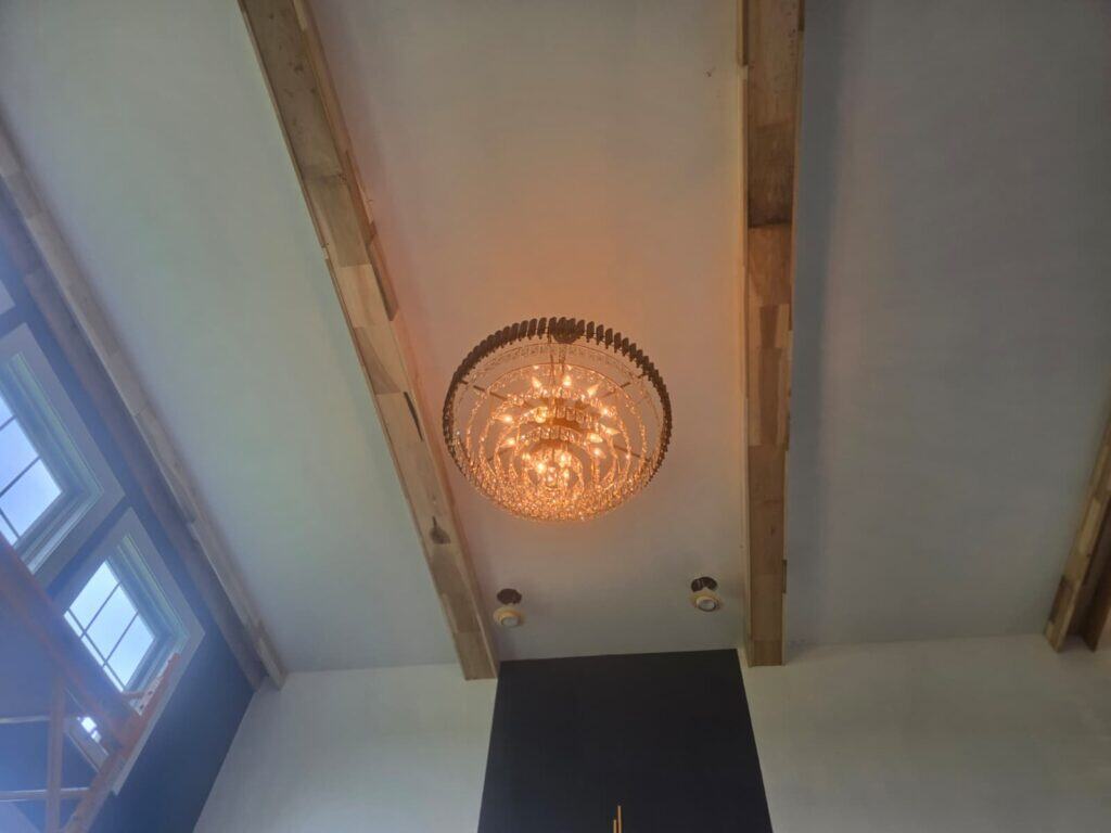 Coffered ceiling installation in Lewis Center, OH featuring poplar beams, crown molding, and premium painted finish by PaintWerks.