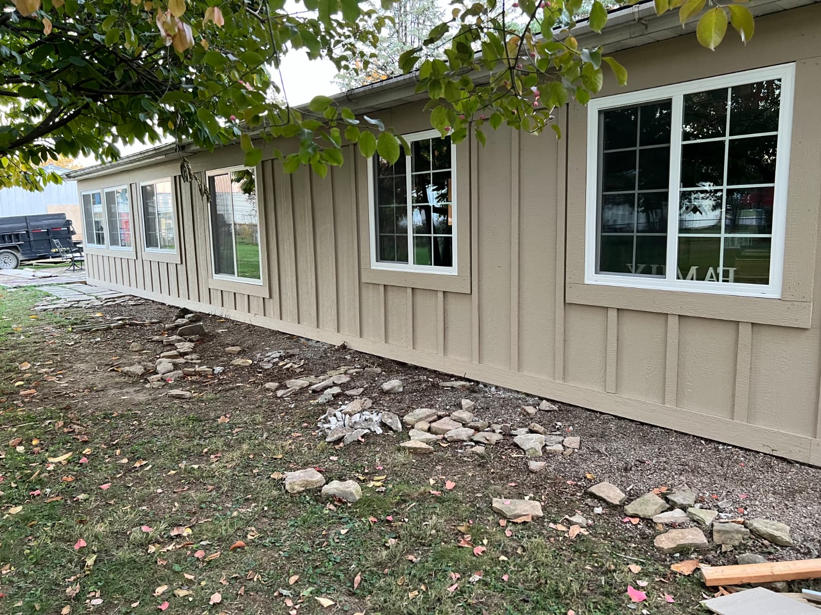 Exterior rebuild in Worthington, Ohio with new framing, sheathing, windows, and LP SmartSide board and batten siding installed by PaintWerks.