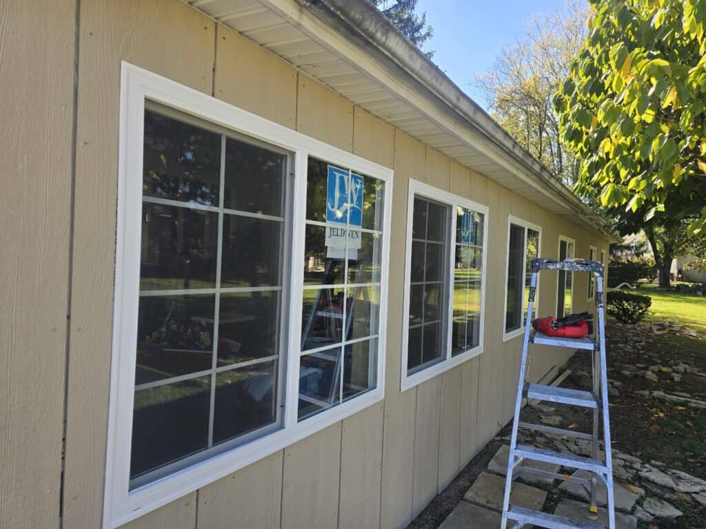 Exterior rebuild in Worthington, Ohio with new framing, sheathing, windows, and LP SmartSide board and batten siding installed by PaintWerks.