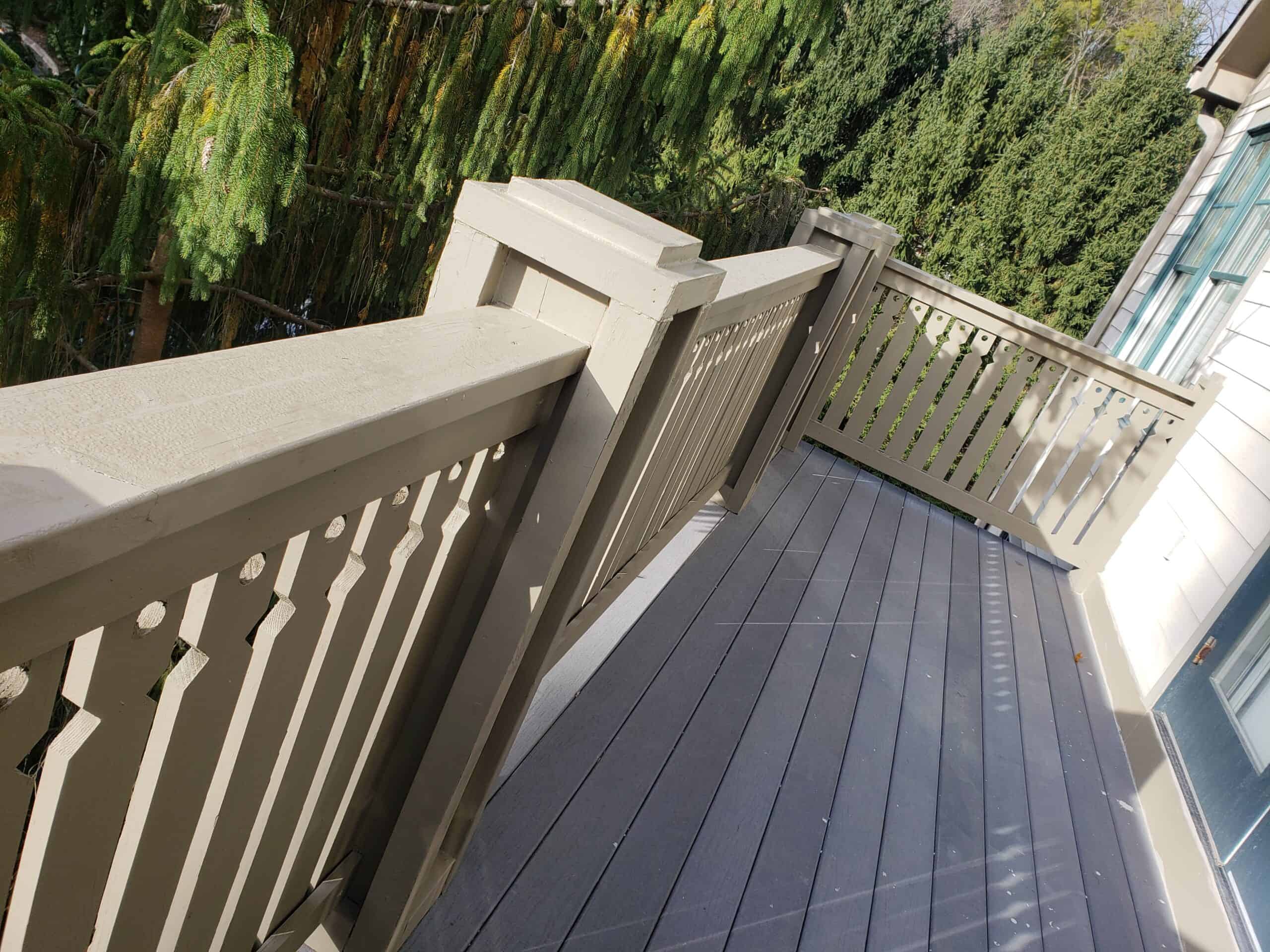 High-quality exterior painting of balcony railing and deck in a home, enhancing outdoor space appeal.