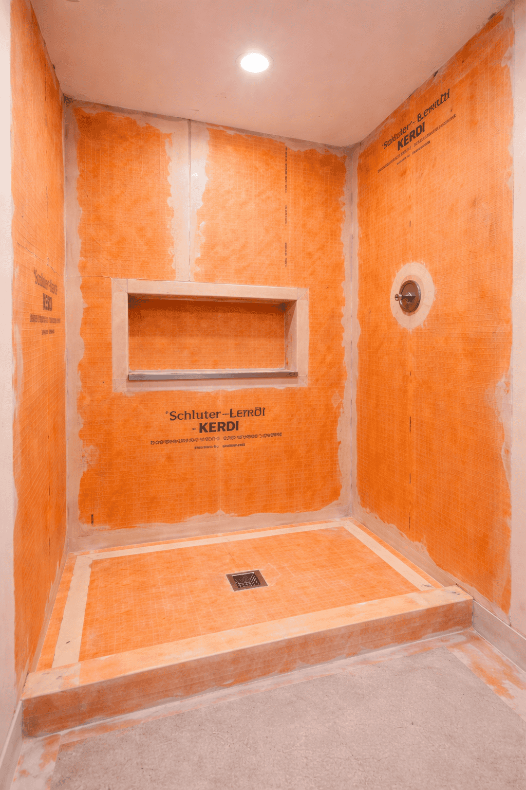 Bright orange bathroom wall primed and ready for painting in Columbus, Ohio.
