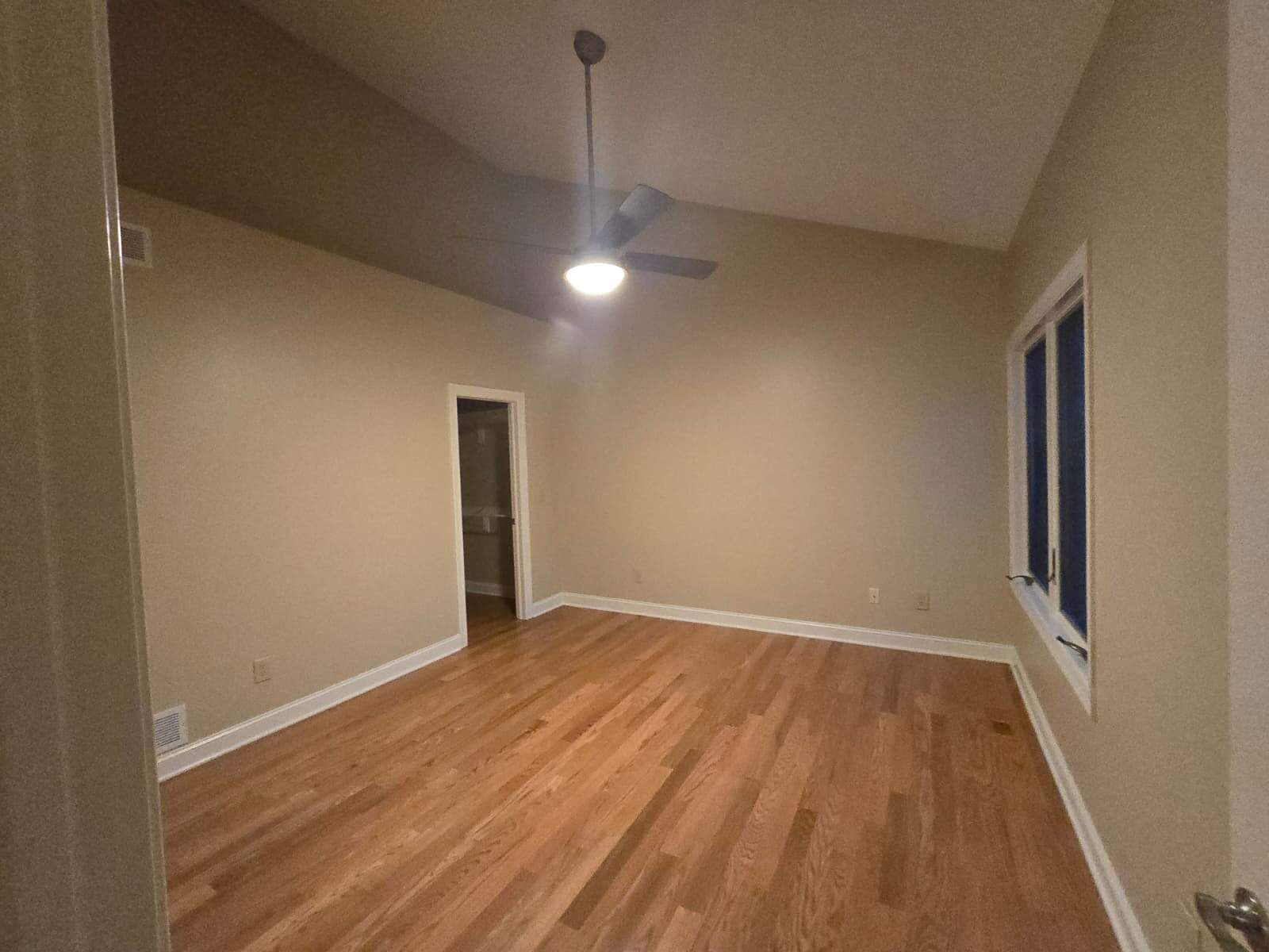 Clean room beige walls ceiling fan hardwood Worthington