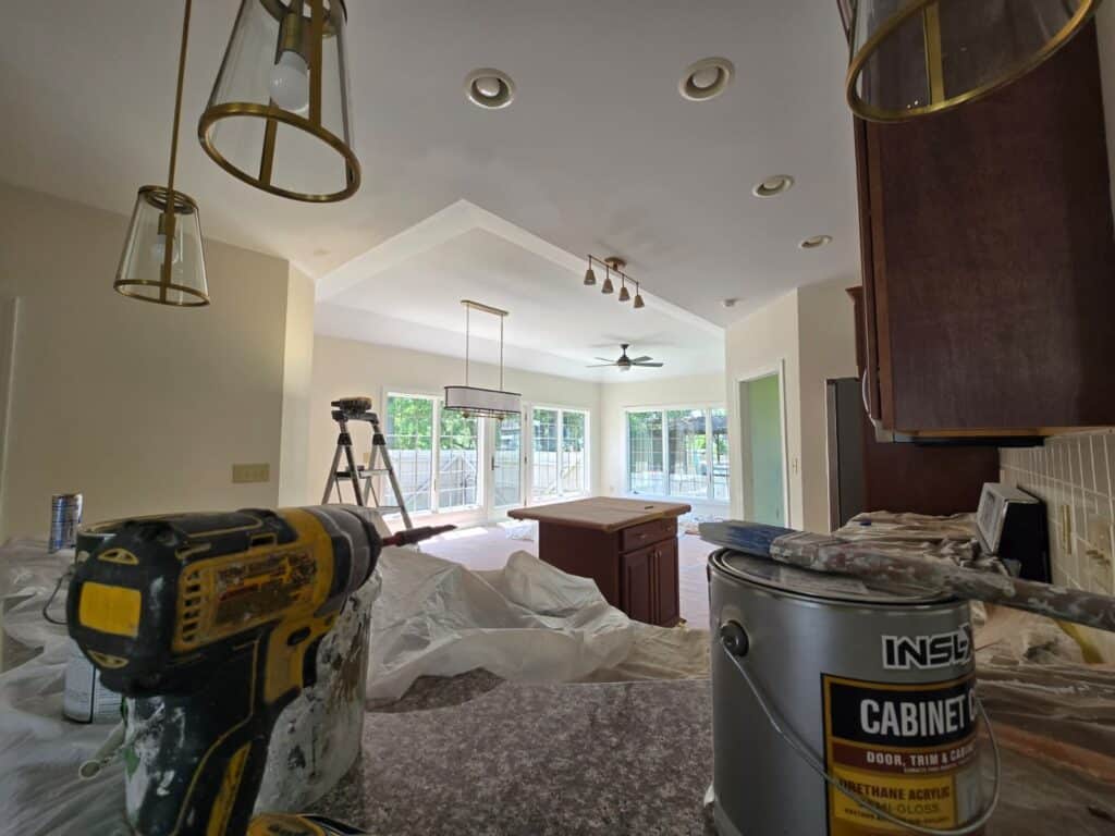 Bright, freshly painted living room with natural light, showcasing expert painting craftsmanship.