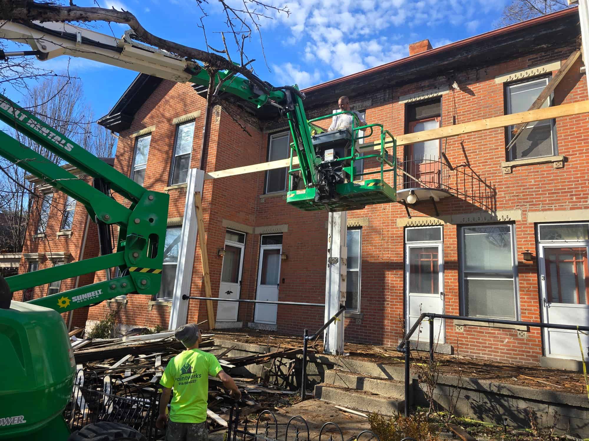 PaintWerks crew boom lift porch framing 90 E Lincoln St Columbus OH