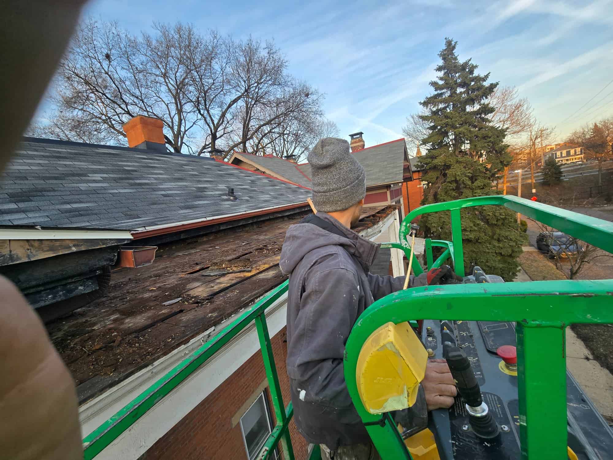 Worker boom lift porch roof 90 E Lincoln St Columbus OH